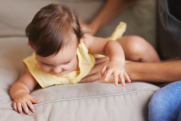Image showing Baby, mom and playing on couch, child development and infant growth with happy, coordination and home. Girl, learning and healthy in good mood, childhood or balance with arms, kid or adorable