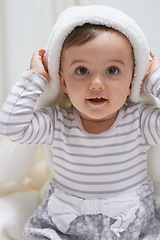 Image showing Cute, smile and portrait of baby with a blanket for playing, sitting and having fun at home. Happy, excited and face of sweet girl kid, child or toddler in a cute casual outfit in nursery at house.