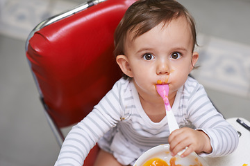 Image showing Eating, cute and portrait of baby in chair with vegetable food for child development at home. Sweet, nutrition and hungry boy kid or toddler enjoying healthy lunch, dinner or supper meal at house.