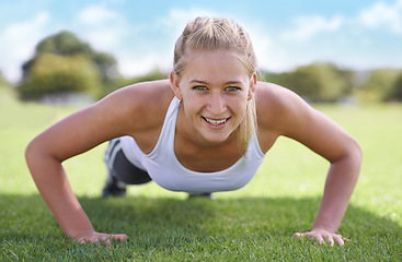 Image showing Women, portrait and push ups on grass for exercise with fitness, training and workout on sports field. Athlete, person and confidence on ground with physical activity for healthy body and wellness