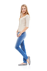 Image showing Woman, portrait and confident with fashion in studio with calm expression, positivity and happy. Model, person and satisfaction with casual outfit, trendy clothes or mock up space on white background