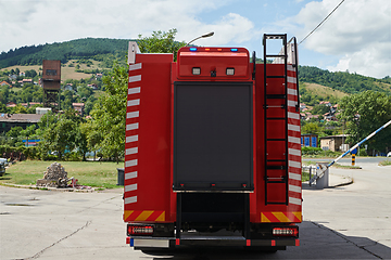 Image showing Close-up of essential firefighting equipment on a modern firetruck, showcasing tools and gear ready for emergency response to hazardous fire situations