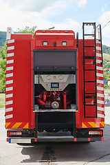 Image showing Close-up of essential firefighting equipment on a modern firetruck, showcasing tools and gear ready for emergency response to hazardous fire situations