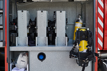 Image showing Close-up of essential firefighting equipment on a modern firetruck, showcasing tools and gear ready for emergency response to hazardous fire situations