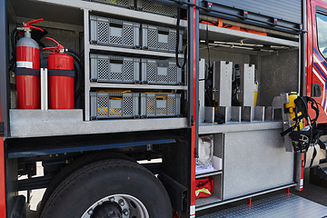 Image showing Close-up of essential firefighting equipment on a modern firetruck, showcasing tools and gear ready for emergency response to hazardous fire situations