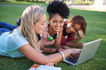 Image showing Grass, laptop or students in park at college, campus or together with online course, smile or group. University, relax or happy friends bond with support, teamwork or diversity in education on field