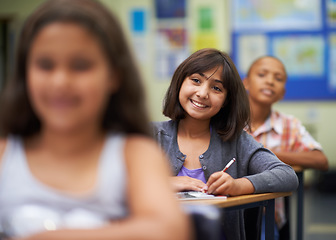 Image showing Students, classroom and writing for learning, primary school and diverse children workbook. Portrait, study and childhood development for education, knowledge and academic information for people