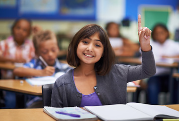 Image showing Students, portrait and raise hand in class, elementary school and ask teacher question. Workbook, study and childhood development for education, knowledge and academic information for people