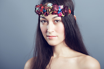Image showing Woman, portrait and flower headband in hair with beauty, skin glow and wellness on grey background. Face, hairstyle with floral head gear or accessory, dermatology and cosmetics to blossom in studio