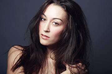 Image showing Beauty, cosmetics and face of woman with hair in studio, hairstyle and shine isolated on dark background. Portrait, makeup glow on skin with dermatology, haircare and texture with growth and model