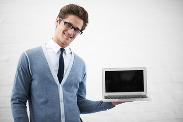 Image showing Happy man, portrait and laptop screen for advertising or marketing on a gray studio background. Male person, nerd or geek smile with computer, tech display or mockup space for advertisement, UI or UX