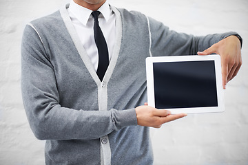 Image showing Man, hands and tablet screen for advertising or marketing against a gray studio background. Closeup of male person or employee showing technology display or mockup space for advertisement, UI or UX