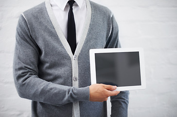 Image showing Man, hands and screen on tablet in advertising or marketing against a gray studio background. Closeup of male person or employee showing technology display or mockup space for advertisement, UI or UX