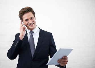 Image showing Business man, phone call and tablet by wall, portrait and contact for networking by white background. Entrepreneur, employee or person with touchscreen, smartphone and mockup space for negotiation