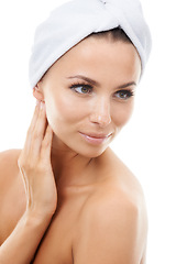 Image showing Woman thinking, white background or skincare in studio for wellness with cosmetics, towel or glow. Facial dermatology, confident person or healthy model touching face or beauty results isolated alone