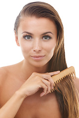 Image showing Hair care, comb and portrait of woman in a studio for natural, health and salon treatment. Beauty, wellness and young female person from Canada brushing for hairstyle isolated by white background.