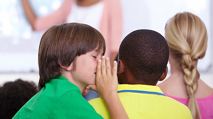 Image showing Children, whisper and classroom in ear for secret, gossip or communication in lesson at school. Person, students or friends listening to rumor, information or eavesdrop in class together with teacher