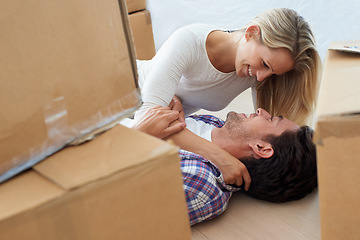 Image showing Couple, boxes and happy or excited for real estate, new home or property investment with romance or love. Moving, man and woman with smile, hug or embrace for fresh start, achievement or dream house