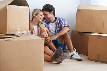 Image showing Couple, boxes and happy with hug for real estate, new home or property investment with romance or love. Moving, man and woman with smile, care and embrace for fresh start, achievement and dream house