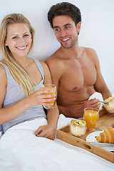 Image showing Portrait of happy couple, morning and breakfast in bed to wake up with food or meal together to relax. Man, smile or woman in home eating healthy snack or drinking juice for diet for love in bedroom