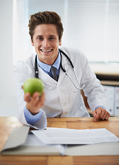 Image showing Smile, apple and portrait of man doctor with stethoscope for positive, good and confident attitude. Happy, pride and young male healthcare worker with fruit in medical office of hospital or clinic.