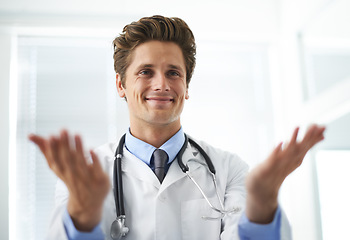 Image showing Welcome, happy and man doctor in office for greeting hello at a medical consultation at clinic. Smile, professional and young male healthcare worker with positive attitude in a medicare hospital.