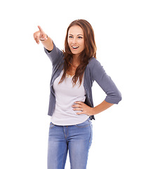 Image showing Woman in studio, pointing and show information with view and smile isolated on white background. Display, happy with announcement or news, hand gesture and direction, deal or message for opportunity