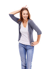Image showing Woman with smile in portrait, bunny ears hand gesture and happy in studio, goofy or silly on white background. Model in casual clothes, fun with emoji or peace sign above head, comic and playful