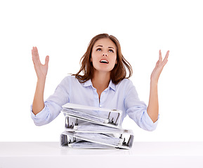 Image showing Stress, overworked and files with business woman in studio isolated on white background for frustration. Tax, why and burnout with young receptionist or secretary overwhelmed by pile of work on desk