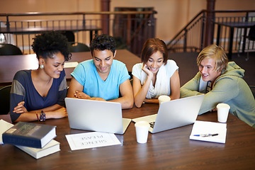 Image showing Teamwork, laptop or students studying together in school, university library or college for education. Diversity, elearning or group of people with scholarship reading news, research or online course