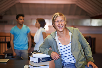 Image showing Portrait, confident or happy man in a library for knowledge or school development for future. Scholarship, education or male student with smile or books for studying or learning in college campus