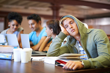 Image showing Tired, study group or portrait of student in library with burnout, depression or low energy. Lazy man, university or exhausted person bored by books with fatigue or adhd with people for teamwork