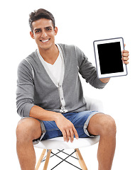 Image showing Portrait, man and space on tablet screen in studio for sign up offer, newsletter or information about us on white background. Happy model on chair for advertising mockup, digital marketing and review