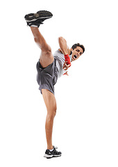 Image showing Boxer, man and kick in studio with sports for fitness, health and martial arts isolated on white background. Strong athlete legs with muscle, action and kickboxing with MMA training and exercise