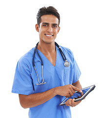 Image showing Doctor, man and tablet in studio portrait for smile, typing or app for medical results by white background. Indian surgeon, medic and digital touchscreen for wellness, healthcare and happy with click