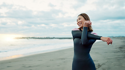 Image showing Smile, beach and woman with happiness, stretching and vacation with getaway trip, seaside and training. Person, Japan and girl with ocean, waves and exercise with journey, muscle and wellness