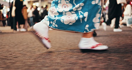 Image showing Japanese woman, feet and walking in kimono in city, journey and wellness for heritage on road. Person, blur or traditional clothes in tokyo street on holiday or sandals for travel in japan fashion