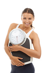 Image showing Studio portrait, happiness and woman with scale machine to track weight loss, exercise results or body transformation goals. Wellness, slim or model confident in BMI, diet or mass on white background