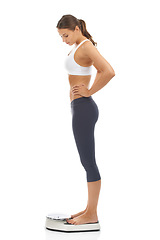 Image showing Woman, scale and for lose weight diet in studio for healthy body, performance or self care. Female person, equipment and target or mockup on white background for fitness training, routine or goals