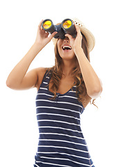 Image showing Smile, travel and woman with binoculars to spy on vacation, holiday or adventure. Vision, glass and person with telescope, search to watch and excited on journey isolated on a white studio background