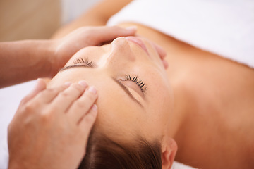 Image showing Woman, spa and forehead massage on face for beauty, holistic therapy and healing at cosmetics salon. Calm client relax at wellness resort for facial reiki, acupressure and peaceful skincare treatment