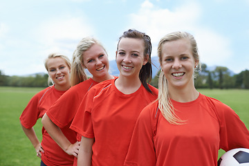 Image showing Girls, players and portrait with soccer ball, confident and football field for match, competition or game. Young, practice or happy for training, outdoor or exercise for athlete, women and sport