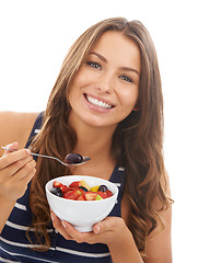 Image showing Portrait, smile and woman eating a fruit salad in bowl for diet, healthy body or nutrition. Face, food and a happy person with an organic breakfast for wellness isolated on a white studio background