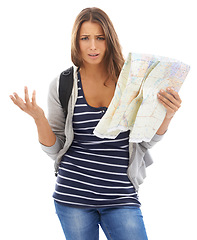 Image showing Map, confused and portrait of woman in studio for hiking adventure, weekend trip or vacation. Travel, discover and lost person with paper directions for tourism and navigation by white background.