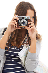 Image showing Photography, camera and young woman in studio working on photoshoot with creativity. Career, art and female photographer student with media project for startup production business on white background