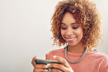 Image showing Phone games, smile or happy woman on break playing online gaming, subscription or connection. Designer ,video gamer or African person with mobile app in workplace for streaming multimedia to relax
