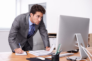 Image showing Business man, writing notes and computer for planning, reading report and planning and documents review. Accountant or auditor with notebook, bookkeeping paperwork and priority or list in his office