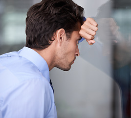 Image showing Depression, business man and head on glass wall for financial crisis, reflection or anxiety for fail. Stress, frustrated and a tired professional in bankruptcy, debt and worry for office mistake