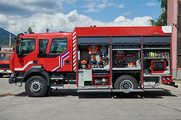 Image showing Close-up of essential firefighting equipment on a modern firetruck, showcasing tools and gear ready for emergency response to hazardous fire situations