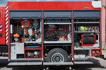 Image showing Close-up of essential firefighting equipment on a modern firetruck, showcasing tools and gear ready for emergency response to hazardous fire situations
